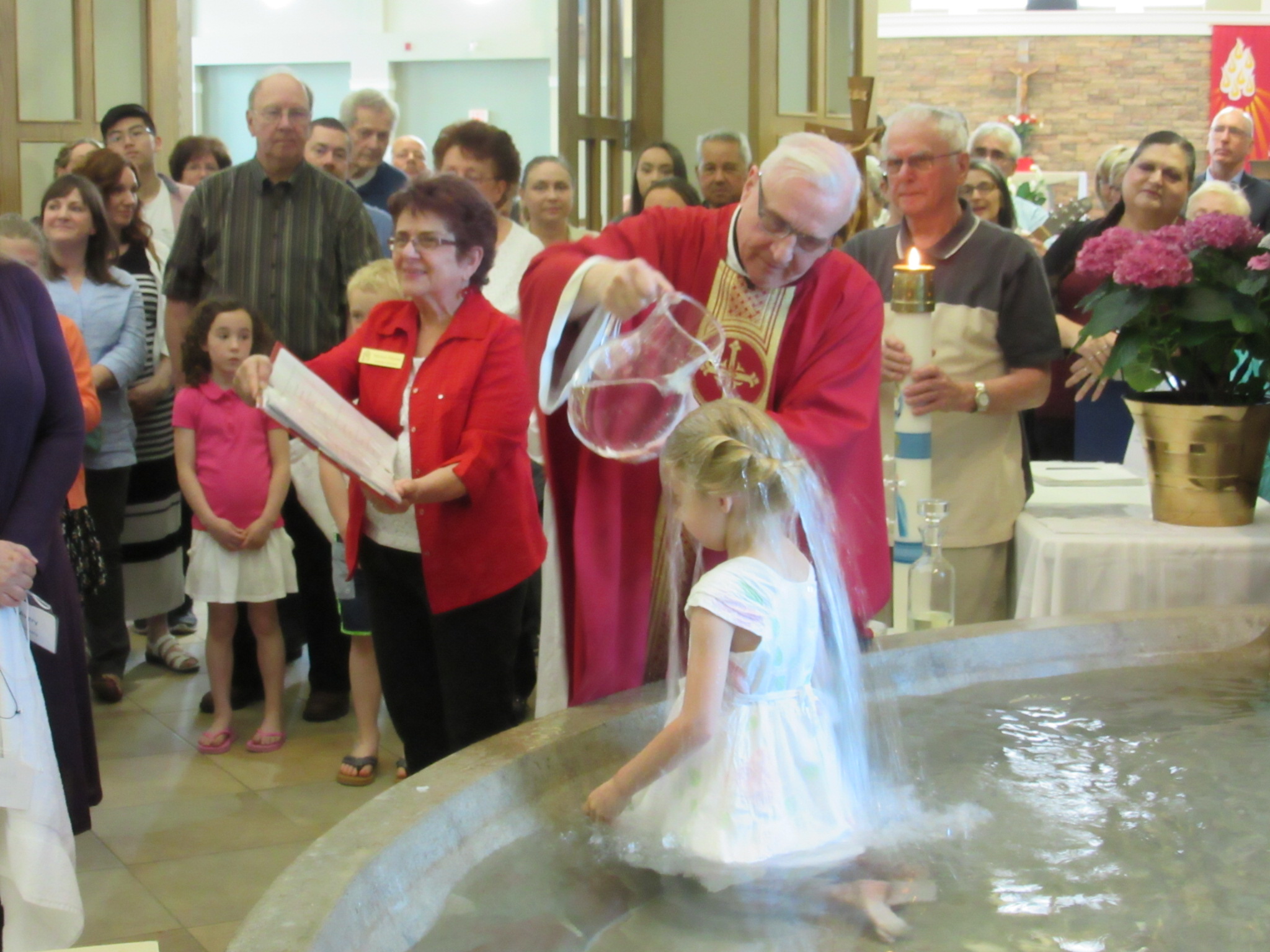 Ashton Rauhala being baptized